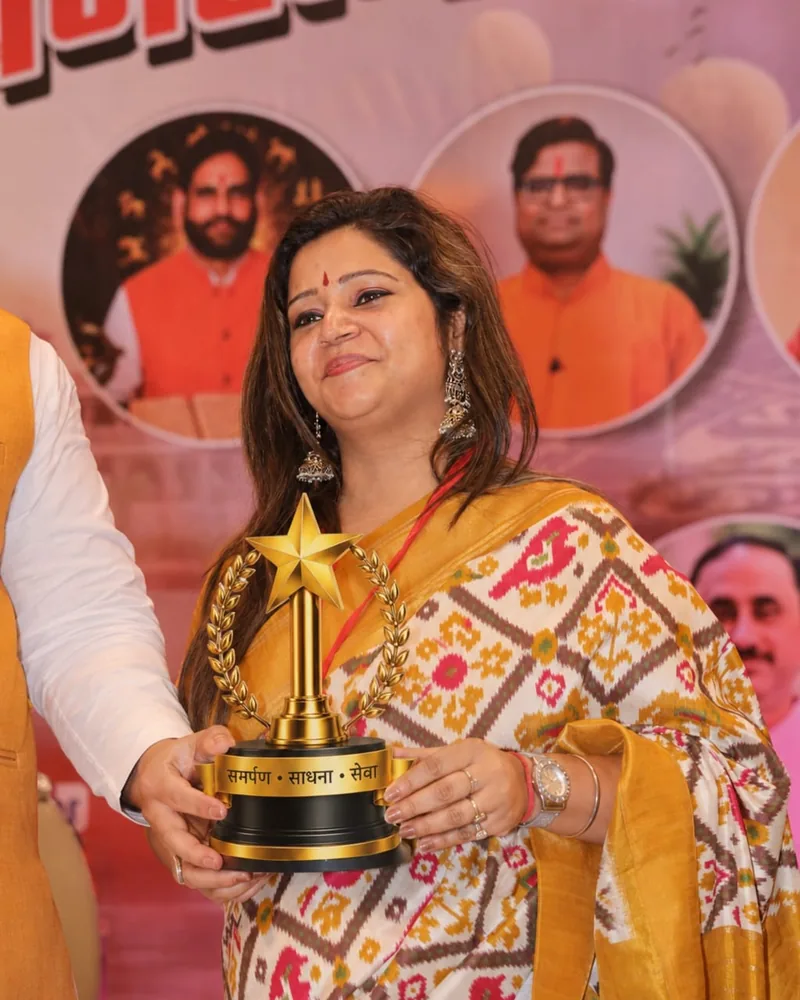Nancy receiving an award on stage