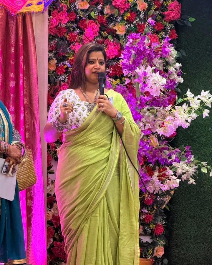 Nancy speaking to an audience at a community gathering